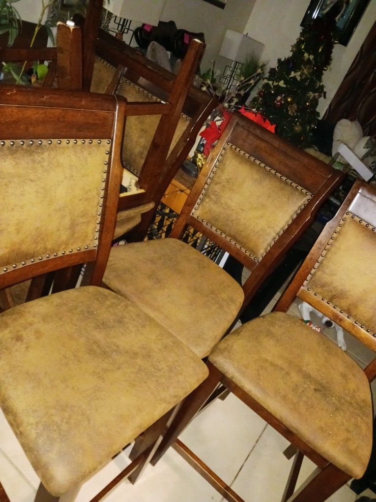 6 GORGEOUS HI TOP DINNING RM CHAIRS OR BAR STOOL CHAIRS SOLID WOOD NO STAINS LIKE LEATHER VELOUR MATERIAL WITH BLACK SWIRL AN LITE BROWNISH COLORS 24i