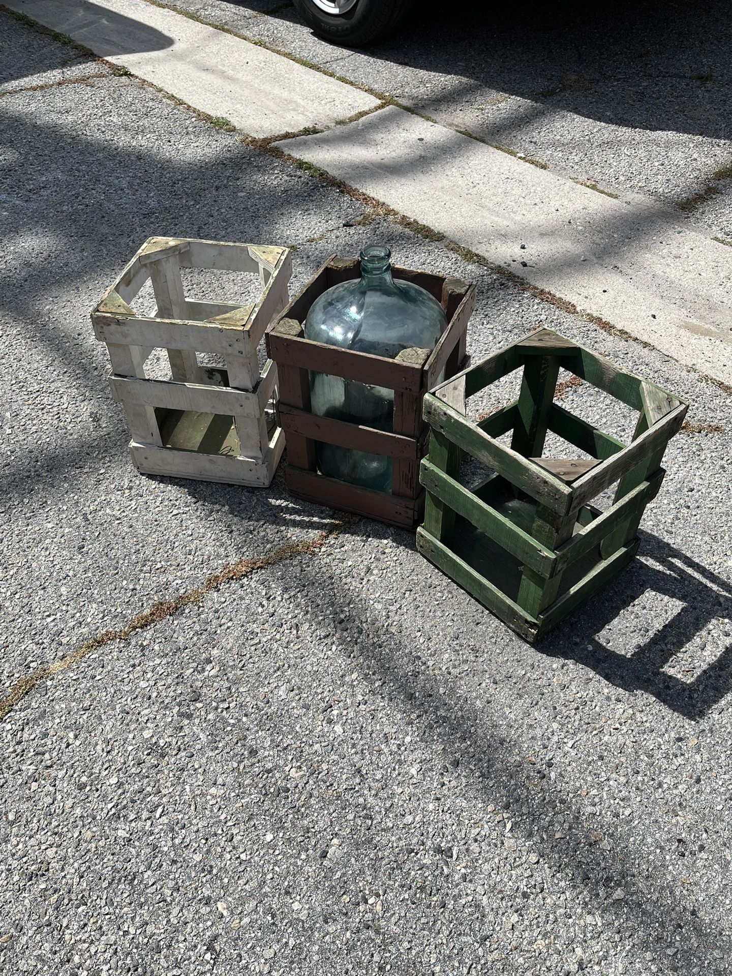 Vintage arrowhead, 5 gallon glass bottle with three crates