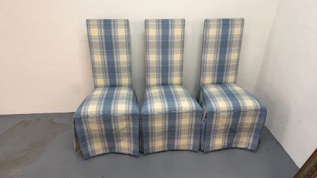 Set of 3 upholstered dining chairs.