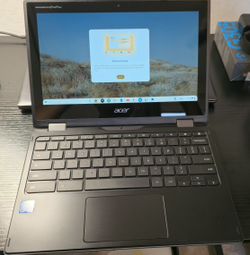 Chromebook Spin 511 + Belkin 2-in-1 magnetic wireless charging pad.