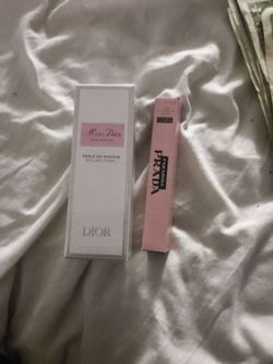Miss Dior perfume and Prada.