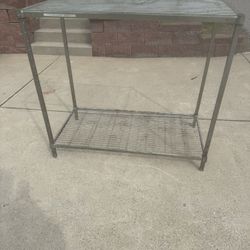 commercial-grade  Rack with 2 Shelves  48” wide  24” deep  44” tall 