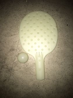Glow-in-the-dark paddle board with ball from 1965