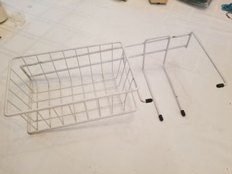 Wall mounted tennis racket and tennis ball rack