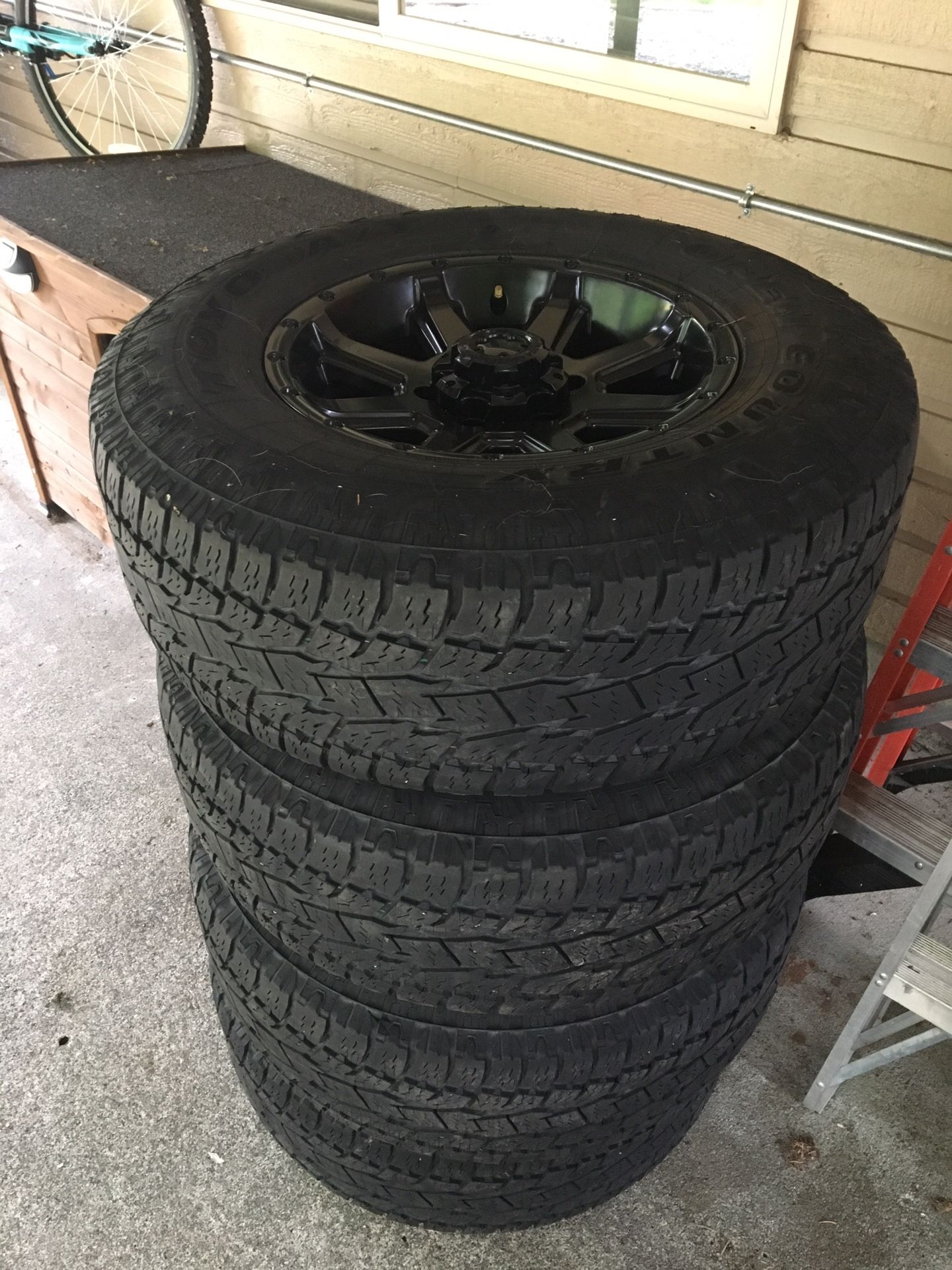 Toyo Open Country AT tires w/ black Crusher rims. 265/70/R16