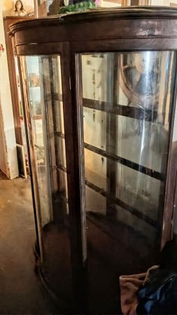 Round glass curio cabinet