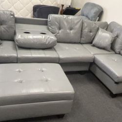 BRAND NEW SECTIONAL COUCH WITH CUP HOLDERS AND OTTOMAN INCLUDED