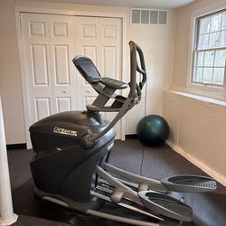 Octane Fitness Elliptical. Weighted Yoga Ball included.