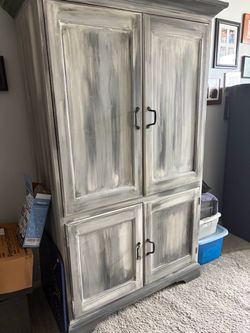 Distressed Gray Wooden Armoire Cabinet