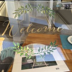 An Acrylic  “WELCOME” Sign
