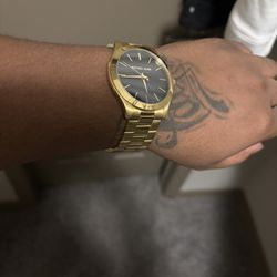 Gold MK watch