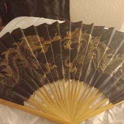 Wall fan fighting dragons decoration .. $10.00 obo