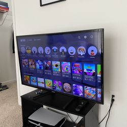 TV, and TV Table, and Keyboard With Mouse