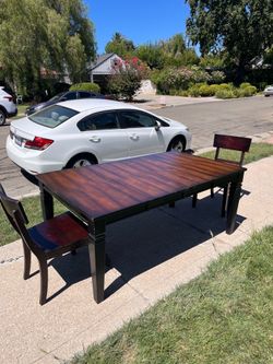 Dining table comes with two chairs