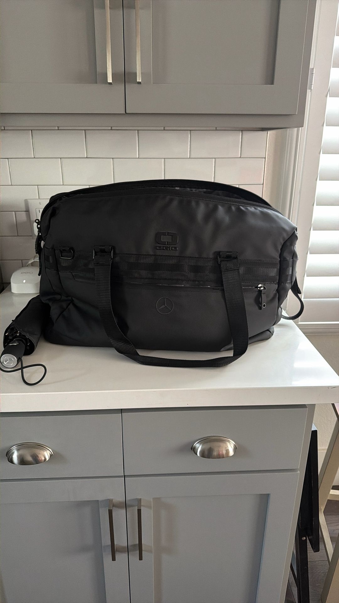 Mercedes Oakley Collab Travel Bag And Umbrella 