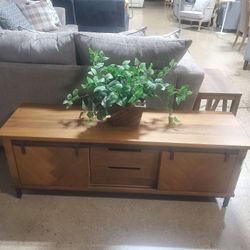 Tv entertainment two sliding cabinet doors with a raised chevron or herringbone pattern