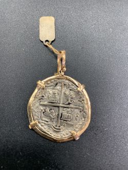 Atocha silver coin pendant in gold bezel