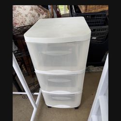 White plastic storage bin on wheels