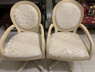 2 beige office chairs