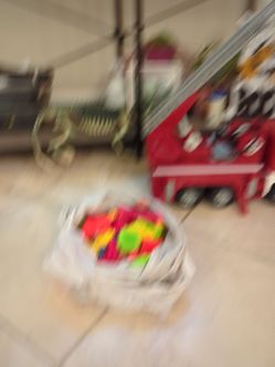 Building blocks and a firefighter truck and also crayons