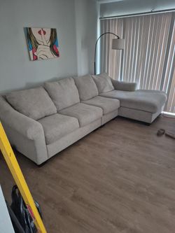 Ashley's fairly new couch, two months old, must go