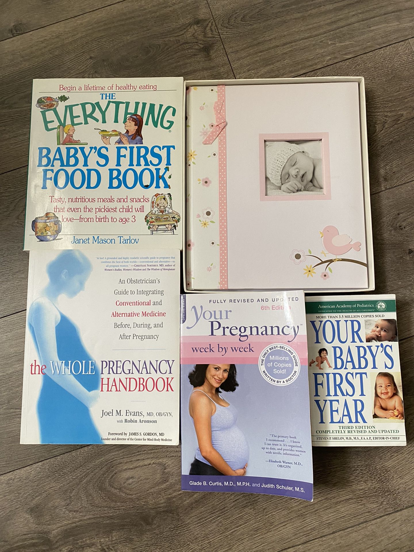 Pregnancy and baby’s first year books plus Photo album