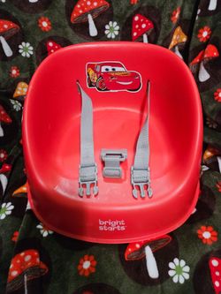 Red Bright Star Disney Cars My Spot Easy-Clean booster seat features a secure three-point harness and a Lightning McQueen character graphic