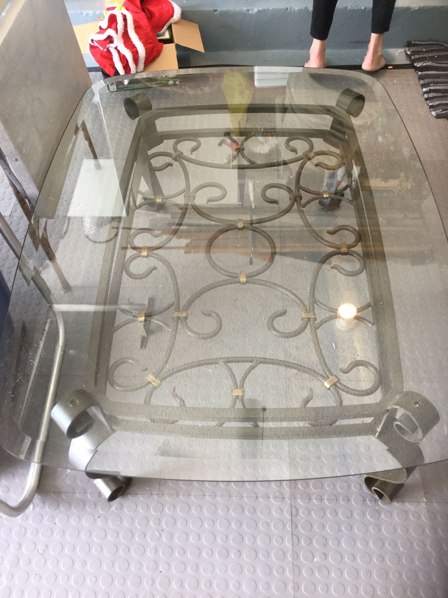 Glass and metal oblong coffee table, 48” x 35”. Excellent Condition.