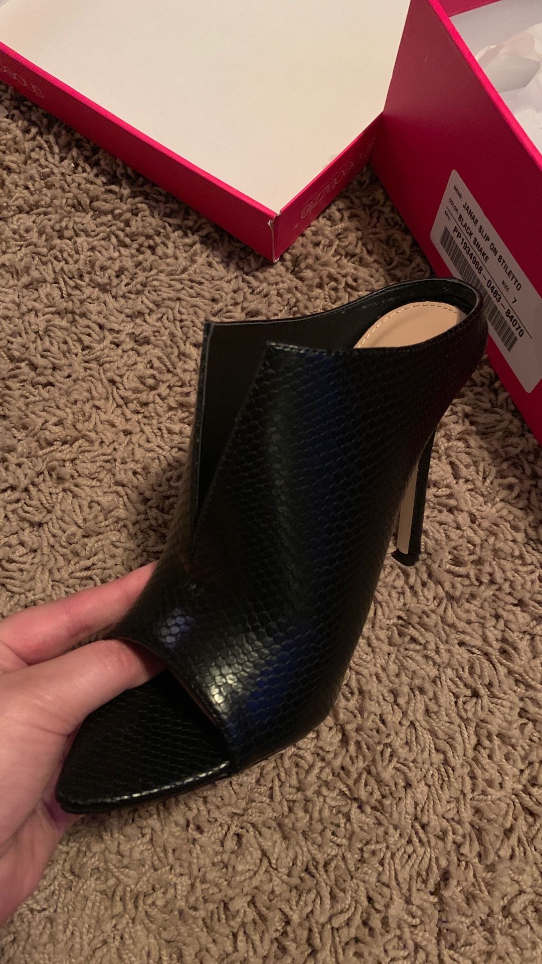 Size 7 slip on black stiletto heels.