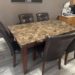 Stone Top Table And Leather Chairs