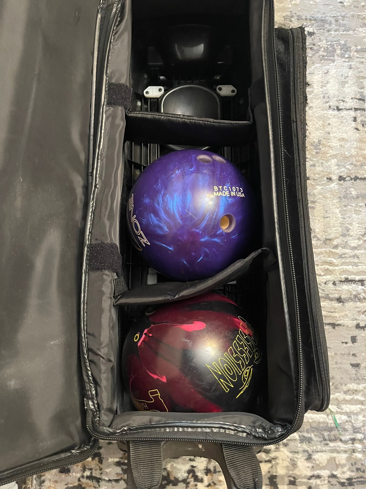 two bowling balls with the bag (one side is a little damaged) comes with 2 gadgets the bowling balls in excellent condition