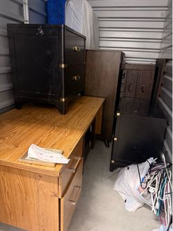Dressers and a twin bed take all