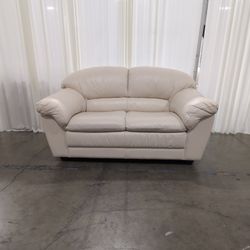 Cream Leather Two-Seat Loveseat with Pillow Arms