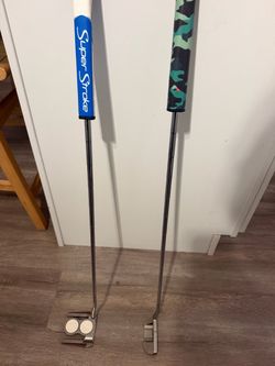 Two Golf Odyssey putters with Custom Grips