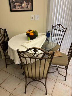 42” Glass table and  4 chairs