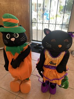 2 standing Halloween decorations about 2 feet tall
