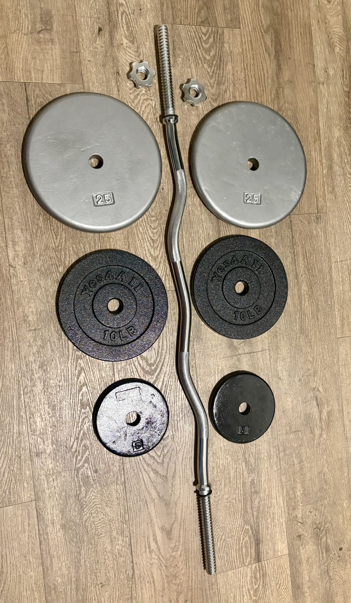 Curl Bar Standard With Pairs Of 25s 10s And 5 lbs Total: 94 lbs