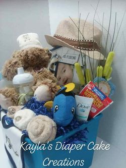 Fishing themed baby gift basket for sale, baby gift, new baby, pampers,  huggies, luvs, picture frame, washcloths, baby toys, dove for Sale in  Tampa