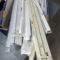 box Of Brand New Vinyl Blinds. It Has The Tools For The Windows And The Stick To Open And Close The Blinds.