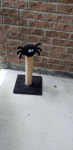 PuzzlePaw gothic cat scratching post features a unique spider-shaped plush topper and a sturdy base for your feline