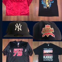 Assorted Clothing Brand New (Yankees, NJ Devils, NYC Blackout, The Rock Wrestling) Tees, Jacket, Fitted, Jersey- $0