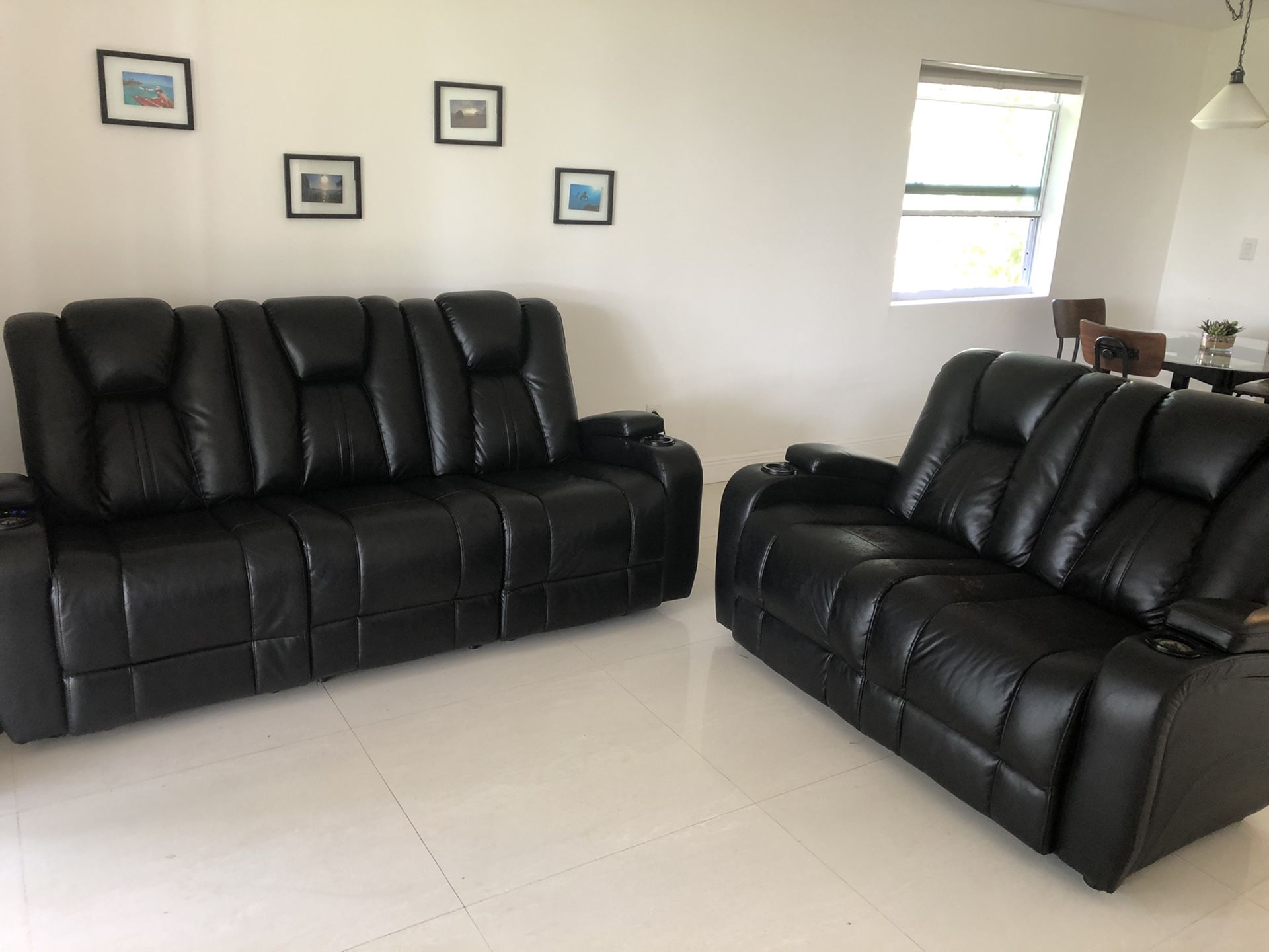 Leather couch and love seat. Recliner, electronic sofa