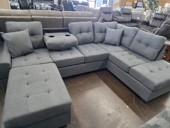 Dark grey  microber sectional with dropdown cup holder