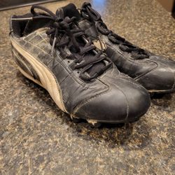 Size 9.5 women shoes Puma black cleats