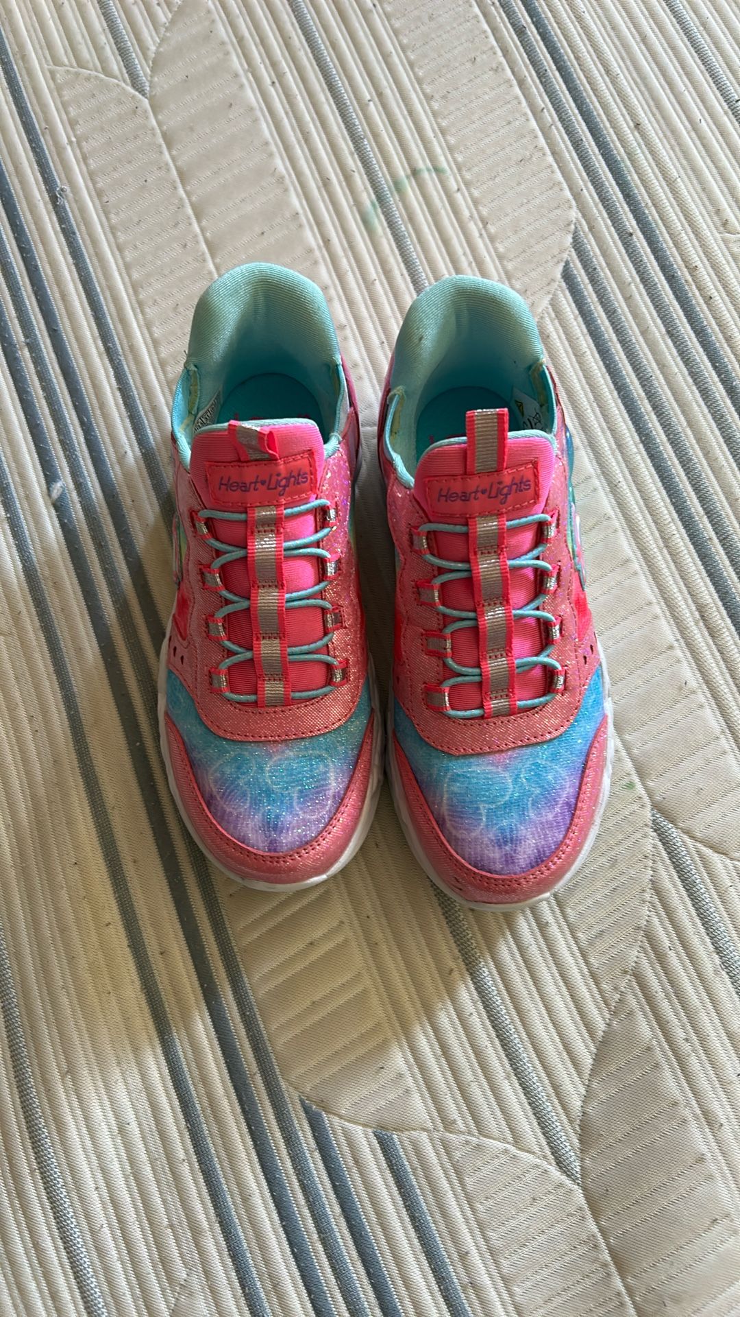 This is a pair of Skechers Hands Free Slip-ins Heart Lights sneakers.