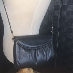 Black leather clutch purse with braided trim by Morris Moskowitz