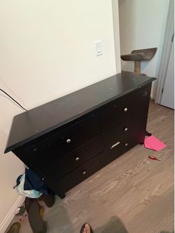 Six drawer black dresser in good condition