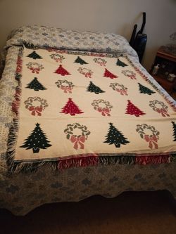 Large heavy lap blanket. Across a queen bed so pretty big. Small coffee stain as shown in last pic. Had also been used as a table cloth