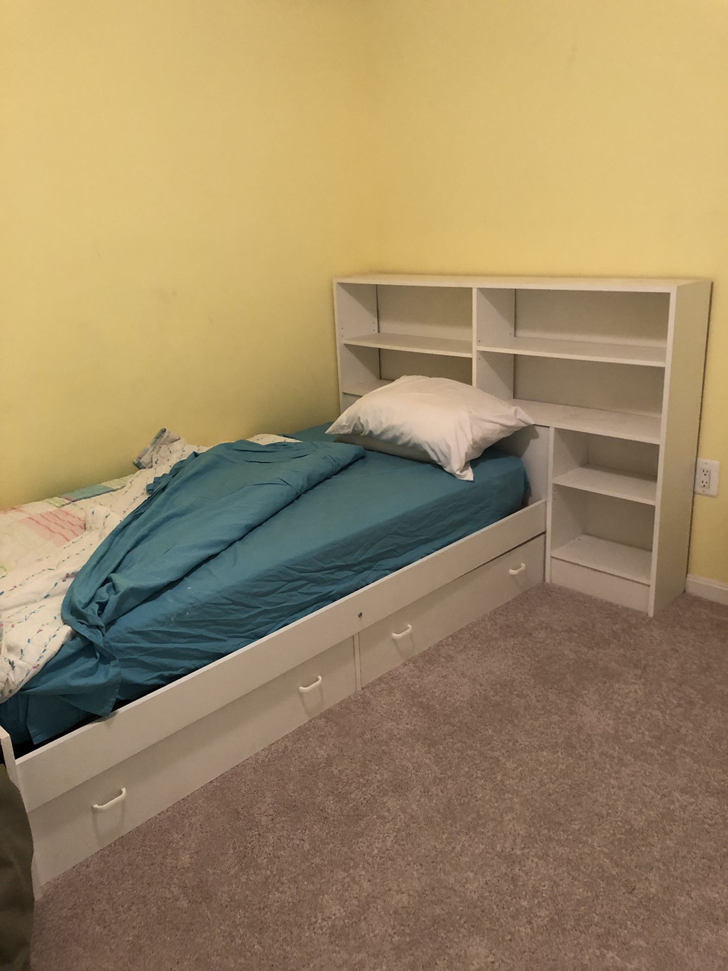 Twin beds. One with storage and attached bookcase ($60). One with just mattress, box spring and metal frame. Must pick up from 2nd floor of house.