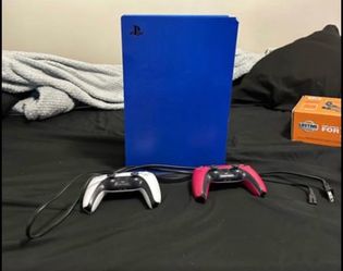 Blue digital ps5 with controllers